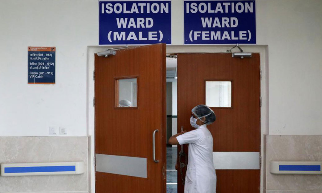 A paramedic staff member enters a newly setup isolation ward for the people who suffer symptoms of Coronavirus at a hospital in Kolkata